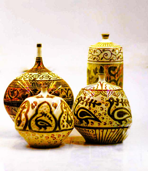 Ceramic decor material pairing with wood, stone, glass, metal and warm lighting in jars