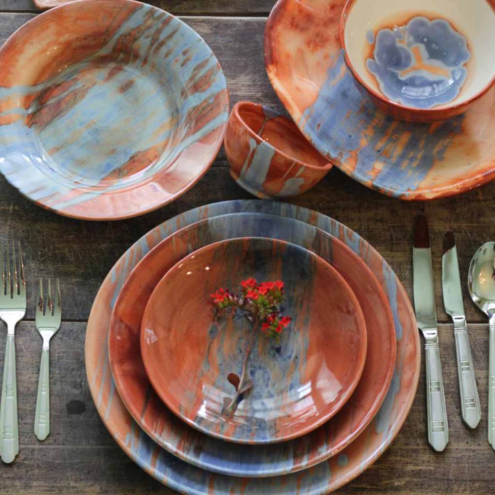 ceramic dish styled with other ceramic objects dining table