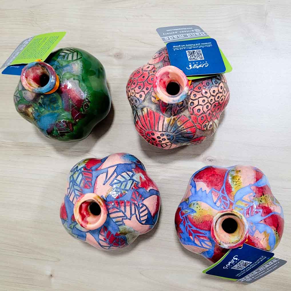 Ceramic pomegranate décor styled with handmade ceramic art objects