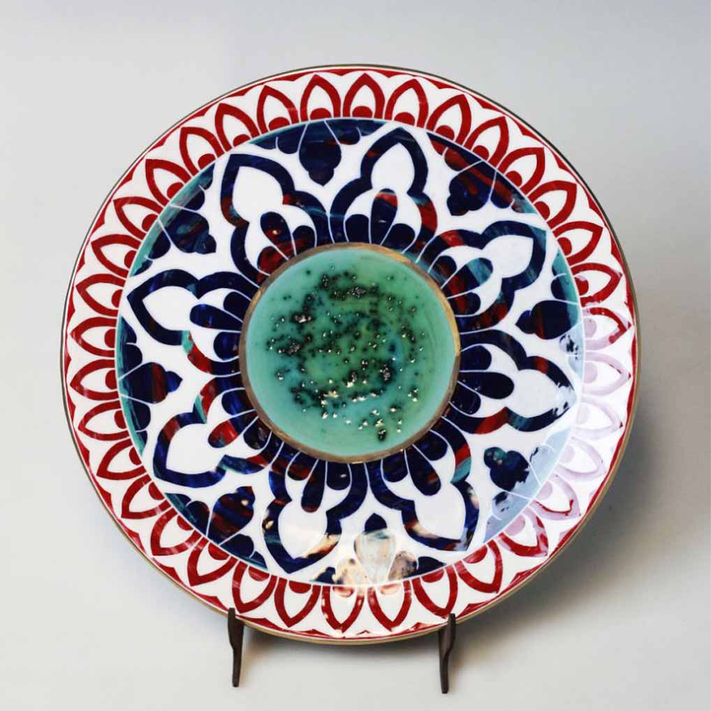 Decorative ceramic dish displayed in an elegant console table arrangement