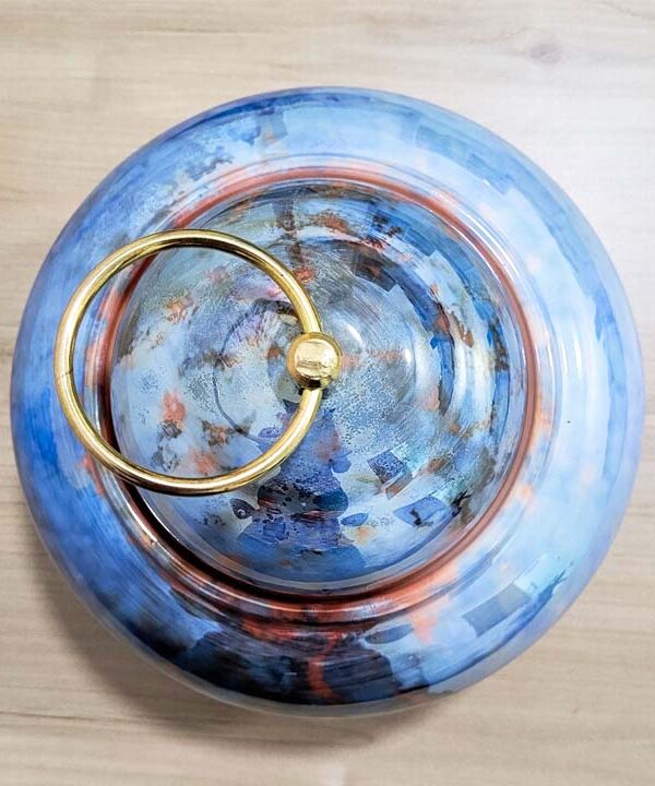 Glazed ceramic décor styled in a refined interior with warm lighting and natural materials