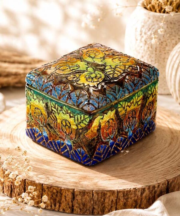 Handcrafted ceramic art styled in a luxury interior with warm lighting and refined materials