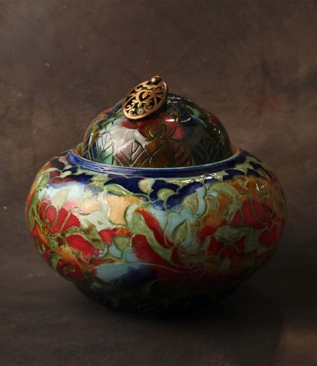 Handcrafted ceramic décor styled in an elegant interior with warm lighting