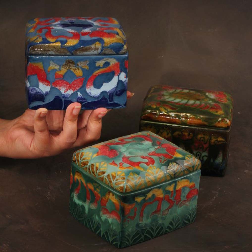 Handcrafted ceramic decor paired with wood stone metal fabric and warm lighting