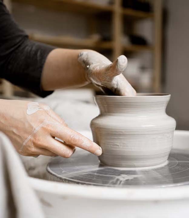 Handmade ceramics compared with mass-produced ceramic decor in a refined interior