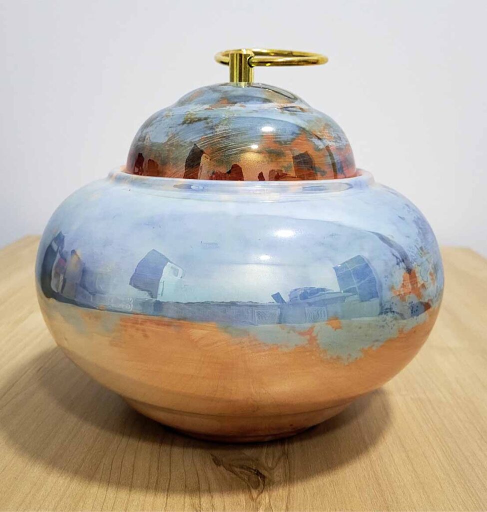 Textured glazed ceramic surface showing shadow, relief and handcrafted detail